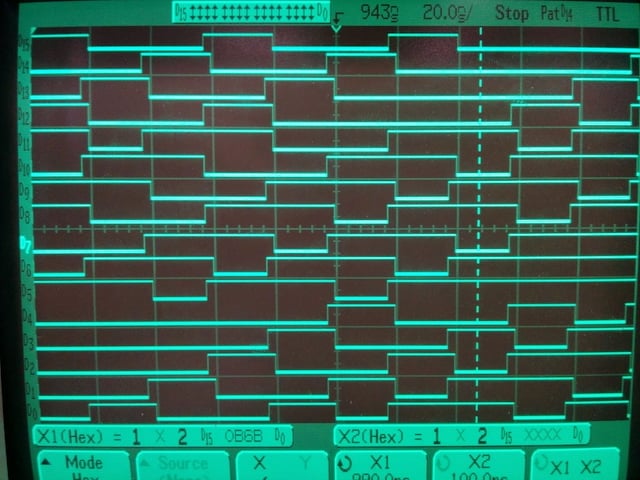 a photo of a monochrome green digital logic analyzer screen showing multiple waveforms