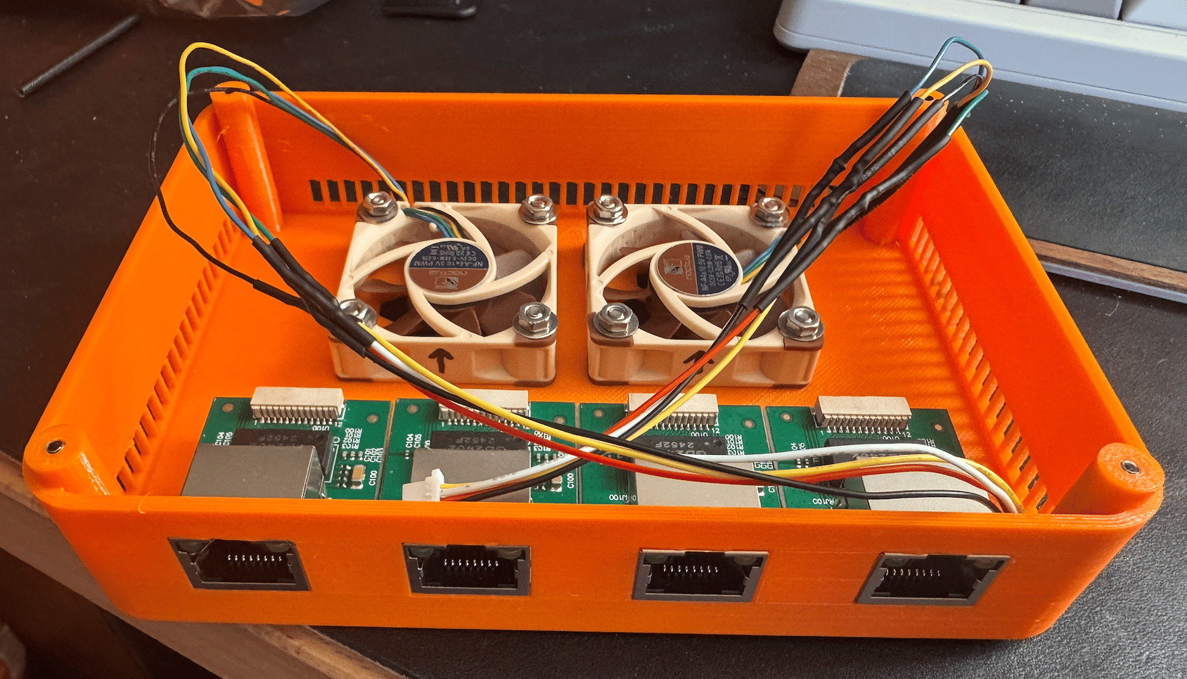 bottom case with all 4 jack PCBs mounted and both noctua fans mounted with cables adapted