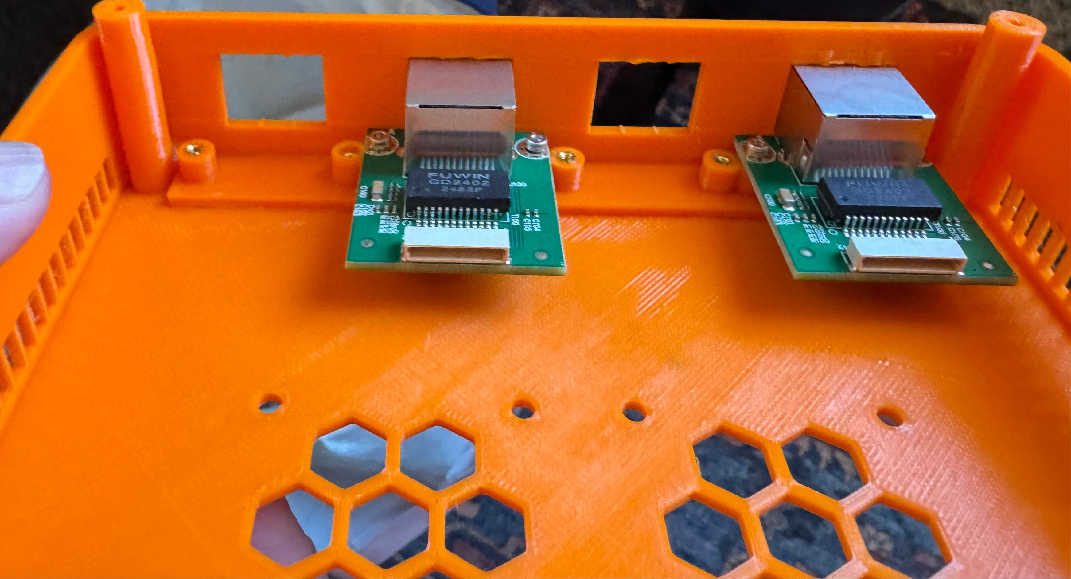 PCB rail with threaded inserts glued into case shell