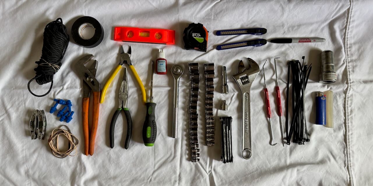 My current tool kit spread out on a sheet.