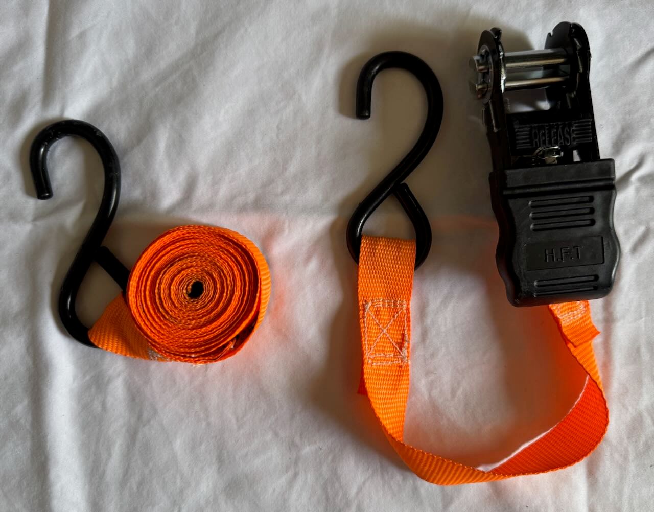 An orange ratchet strap.