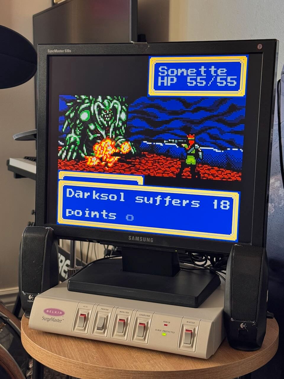 A monitor showing a retro video game being played