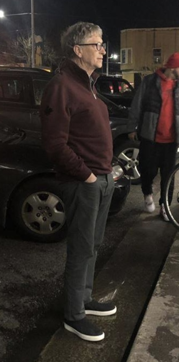 Bill Gates waiting  in line for Dick's